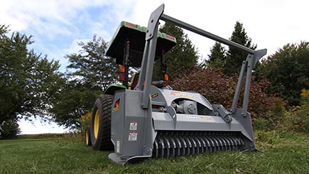 The integrated brush bar helps control the brush and bend taller brush for easier mulching.

