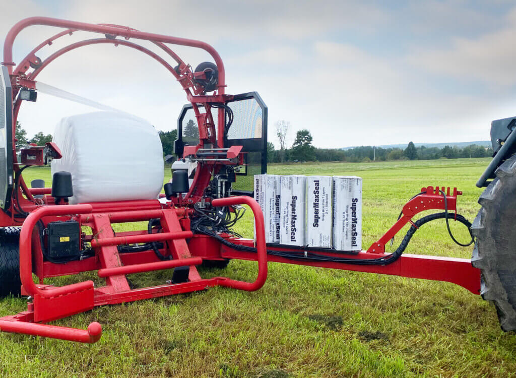 To speed up bale wrapping using conventional single bale wrapping, you need to increase the wrapping table’s rotation speed. But this can be problematic when faced with large, oddly shaped bales like cones or sags, as you must keep the table’s RPM under 20-23 to avoid ejecting the bales.